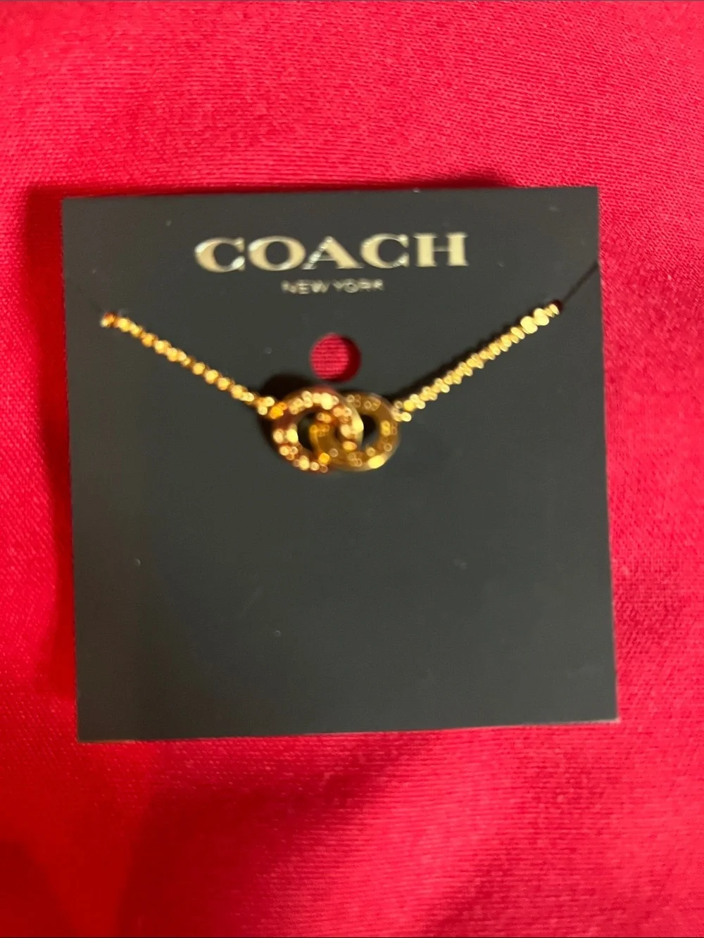 COACH Gold Knot Pendant Necklace